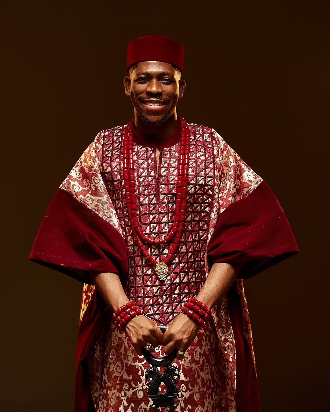 With a magnificent red and gold agbada, Moses Bliss rings in thirty in a grand fashion.