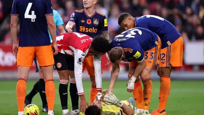 Nick Pope goes down with an injury against Brentford